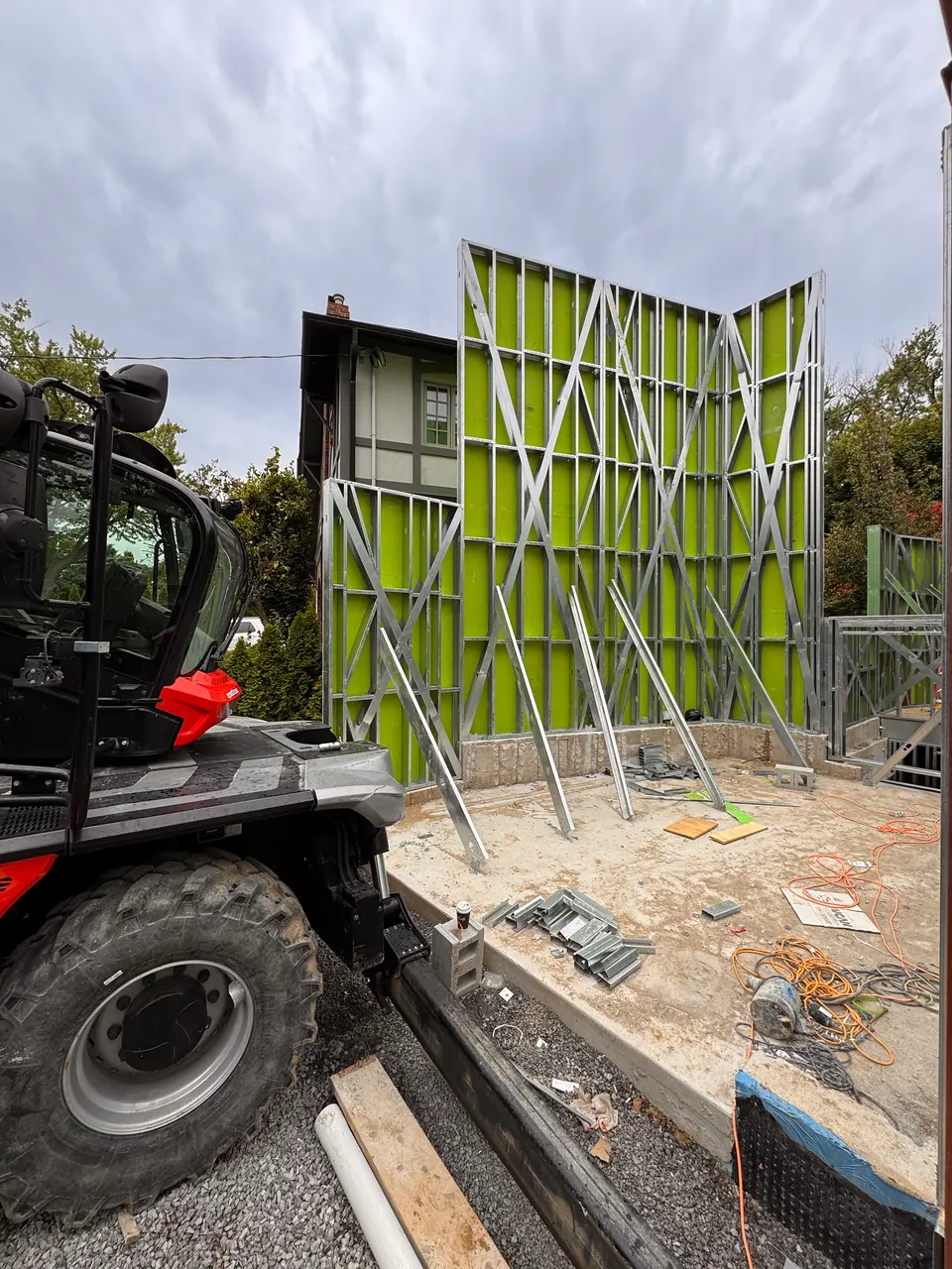 Telehandler working beside the frame