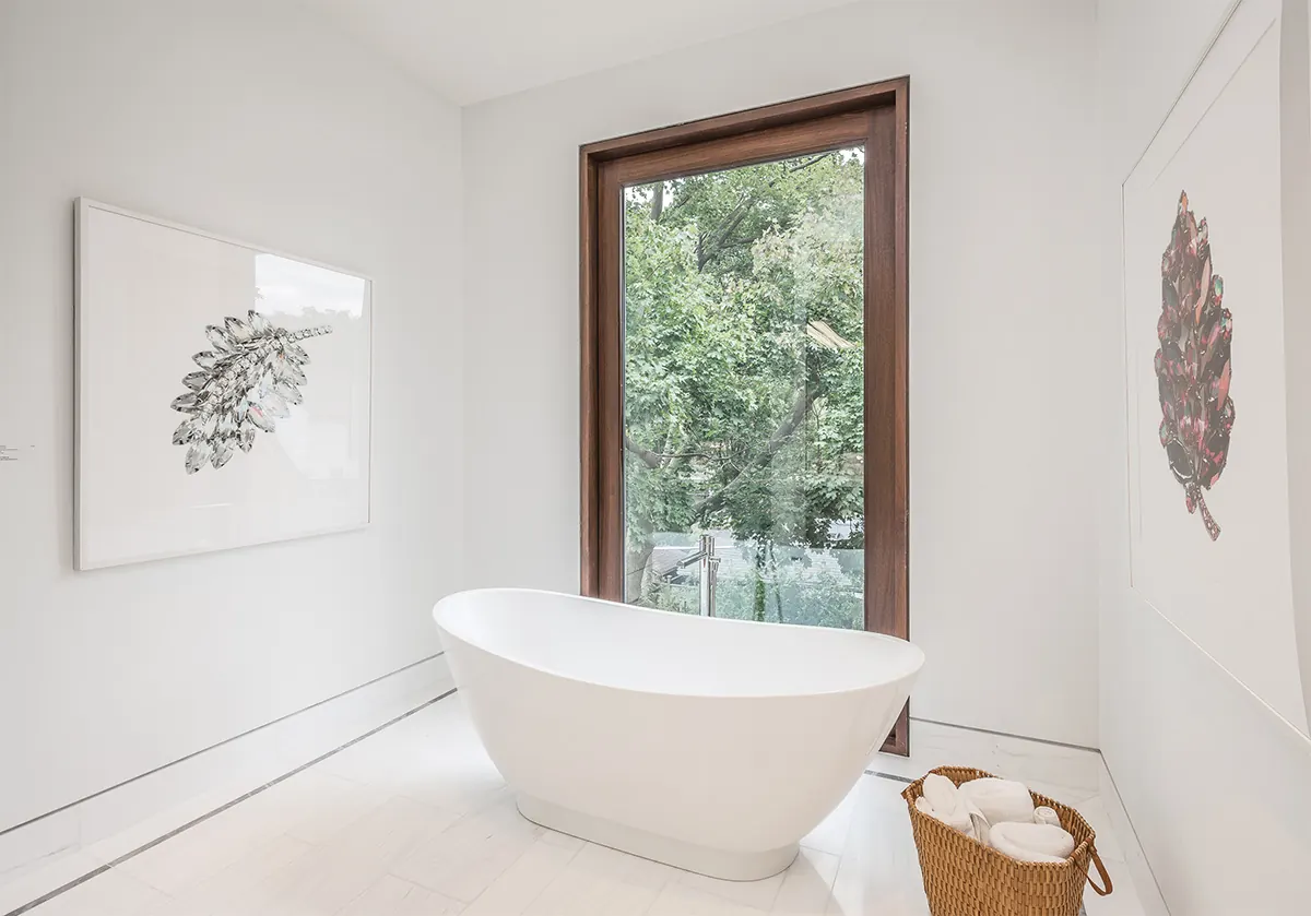 Freestanding tub by a garden window