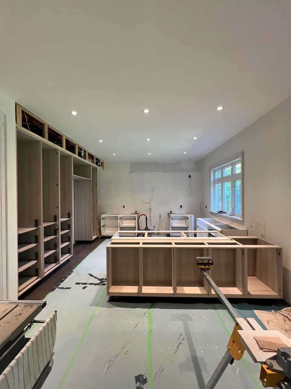 Closet millwork being installed on site